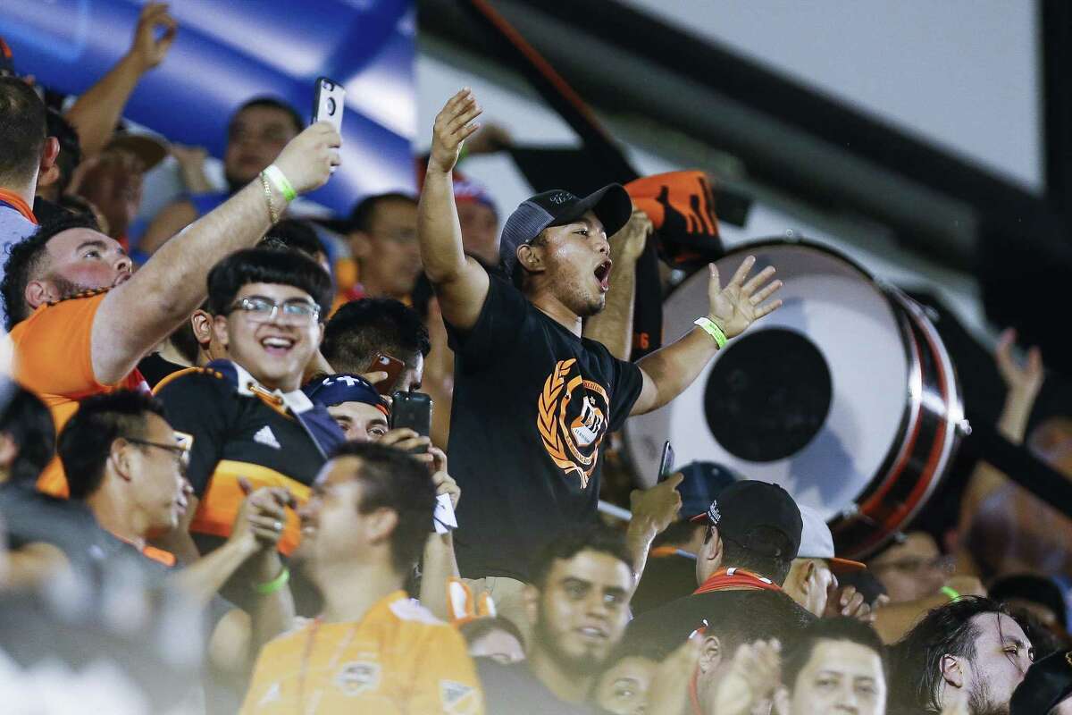 Fans cheer after Houston Dynamo forward Mauro Manotas (9) scored his second goal as the Houston Dynamo take on the Philadelphia Union in the 2018 Lamar Hunt U.S. Open Cup Final at BBVA Compass Stadium Wednesday Sept. 26, 2018 in Houston.