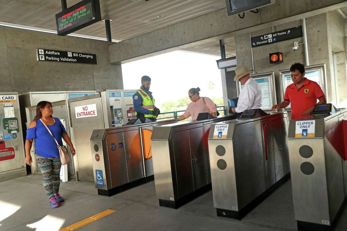 BART riders leave the Pittsburg Center Station. Suburban directors urge more enforcement.
