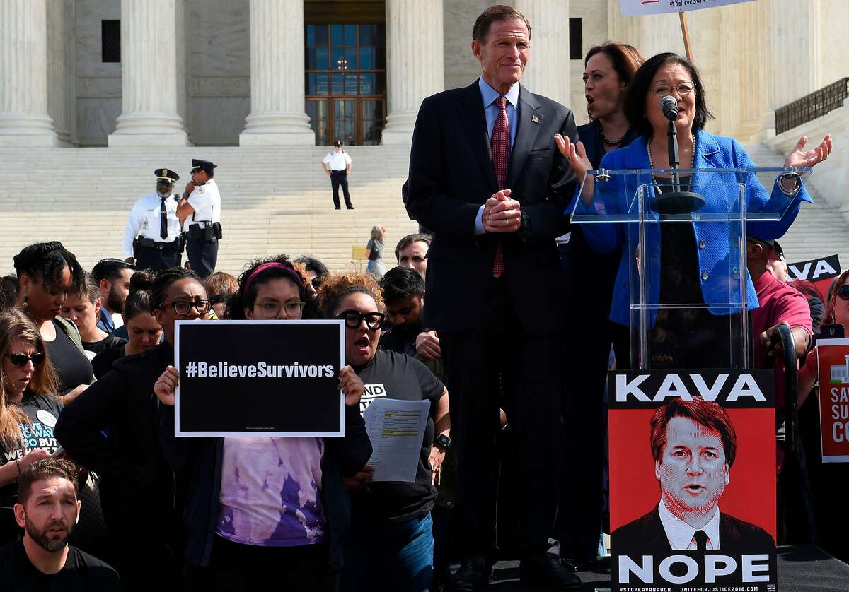 Demonstrators protesting against Judge Brett Kavanaugh's nomination as an Associate Justice on the Supreme Court lissetn to Senators Richard Blumenthal (D-CT) (3R), Kamala Harris (D-CA) (C), and Mazie Hirono (D-HI) in front of the Supreme Court in Washington, DC, September 28, 2018. - Kavanaugh's contentious Supreme Court nomination will be put to an initial vote Friday, the day after a dramatic Senate hearing saw the judge furiously fight back against sexual assault allegations recounted in harrowing detail by his accuser. (Photo by Eric BARADAT / AFP)ERIC BARADAT/AFP/Getty Images