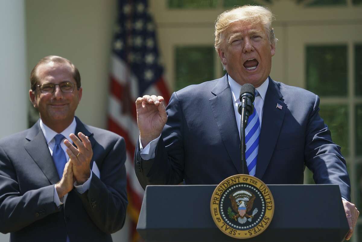 President Donald Trump with Health and Human Services Secretary Alex Azar at the White House on May 11, 2018.