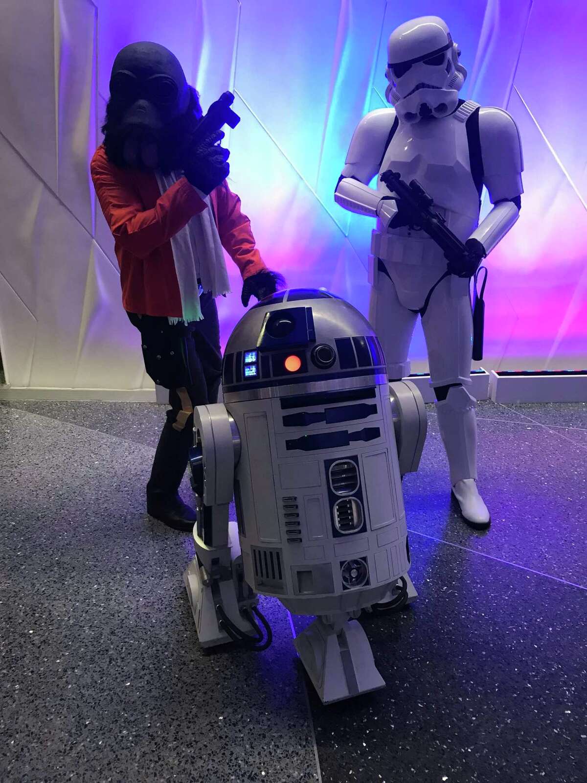 Costumed characters from “Star Wars” prowl the Tobin Center lobby Friday night ahead of the San Antonio Symphony’s movie concert.