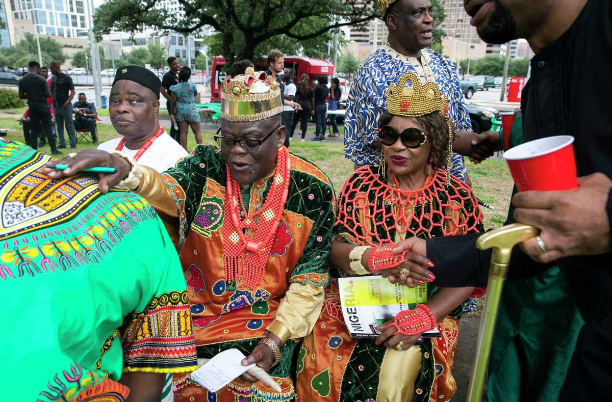 His Royal Highness Eze and UgoEze Obichuku greet people during the second annual Nigeria Cultural Day Parade on Saturday, September 29, 2018, in downtown Houston.