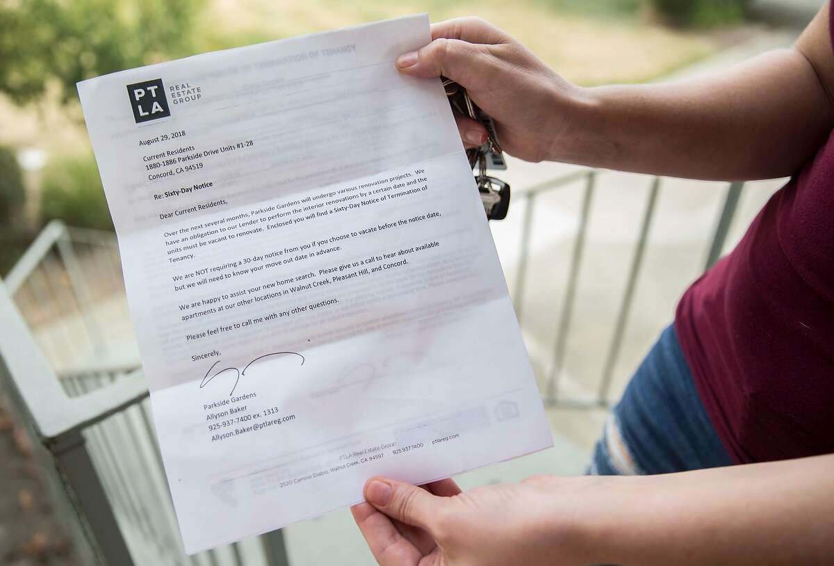 Crystal Chandler shows the eviction notice she was given one month ago while standing outside of her apartment in Concord, Calif. Saturday, Sept. 29, 2018.
