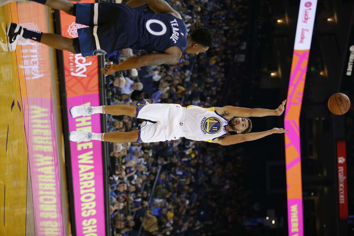 Golden State Warriors guard Klay Thompson (11) attempts a jump shot during the first half of an NBA preseason game between the Golden State Warriors and Minnesota Timberwolves at Oracle Arena on Saturday, Sept. 29, 2018, in Oakland, Calif.
