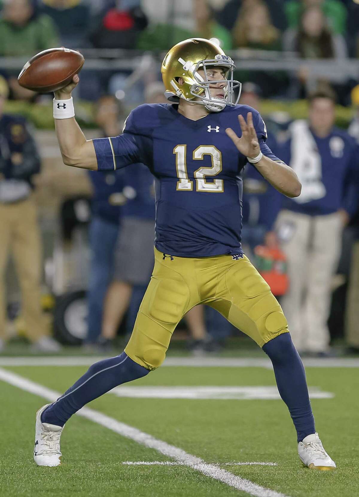 Ian Book of the Notre Dame Fighting Irish passes during their game