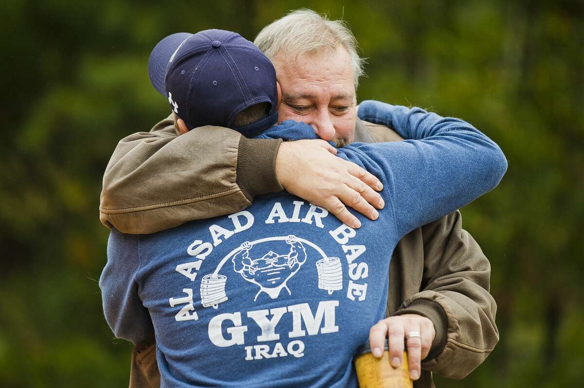 Keith Barnett, right, hugs his son Christopher Williams, left, as Williams returned home Sunday, Sept. 30, 2018 after serving in the Air Force in Iraq. (Katy Kildee/kkildee@mdn.net)