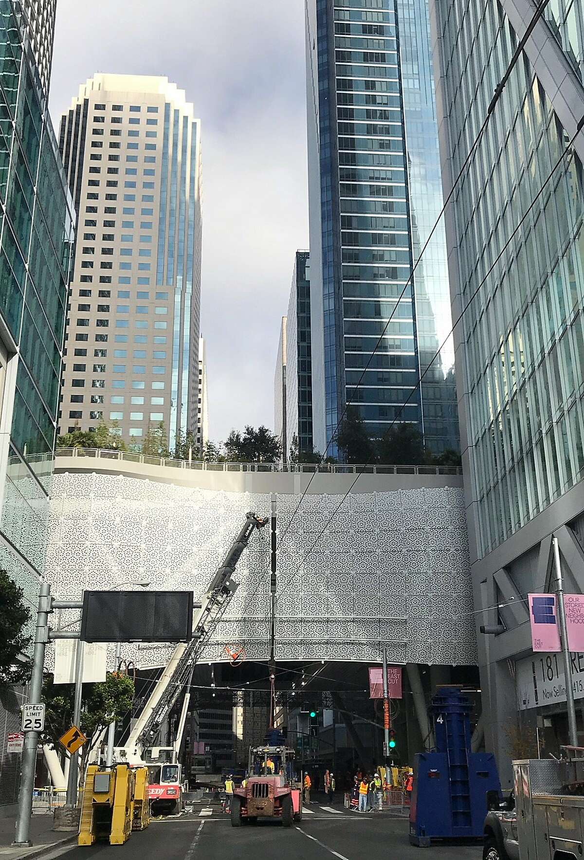 Workers at the Transbay Transit Center unload hydraulic jacks that will be used to temporarily support the damaged building while cracked beams are inspected.
