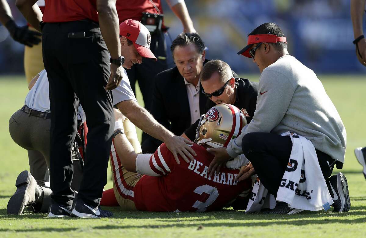 Photo: San Francisco 49ers quarterback C.J Beathard is hit hard