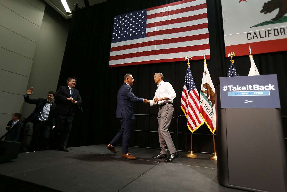 former President Barack Obama, right, shakes hand with California congressional candidates Gil Cisneros, 2nd right, during the Take It Back California event where he campaigns in support of California congressional candidates, Saturday, Sept. 8, 2018, in Anaheim, Calif. (AP Photo/Ringo H.W. Chiu)