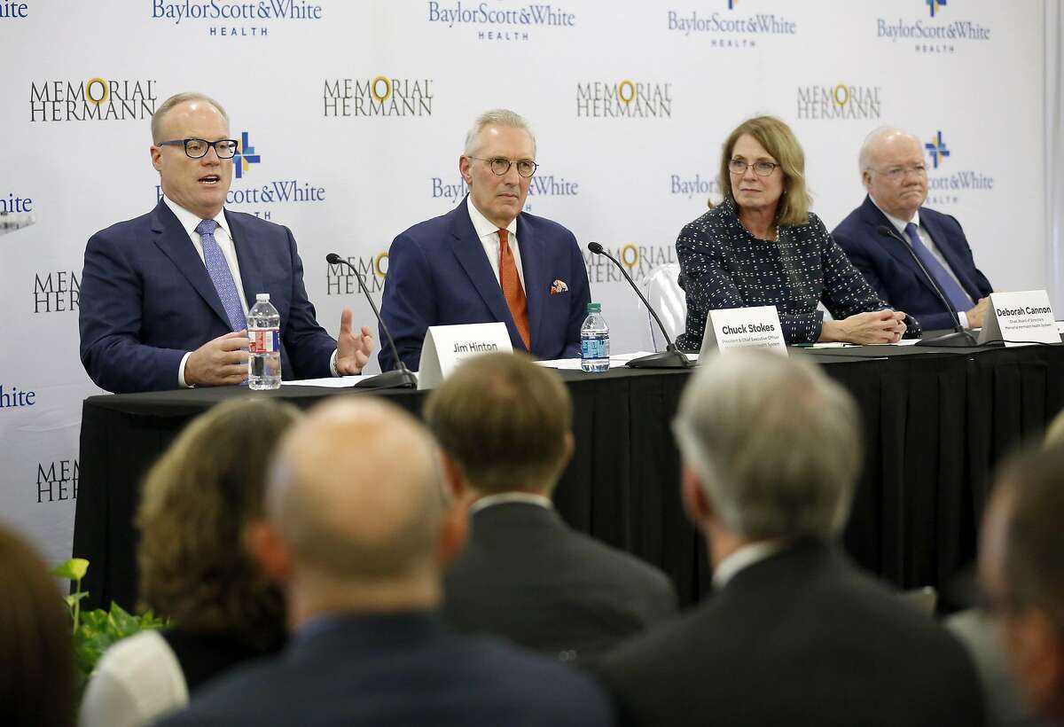 Jim Hinton, left, CEO of Baylor Scott and White Health, speaks alongside Chuck Stokes, president and CEO of Memorial Hermann Health System; Deborah Cannon, chair of Memorial Hermann Health System Board of Directors; and Ross McKnight, chair of Baylor Scott and White Holdings Board of Trustees during a news conference in Dallas to announce the intended merger. (Tom Fox/The Dallas Morning News)