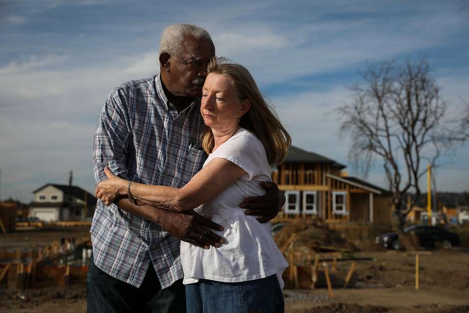 Husband and wife Henry Granger and Astrid Granger embrace as they stand for a portrait on the destroyed property that was their home before the Tubbs Fire tore through it last year in Santa Rosa, California, on Thursday, Sept. 27, 2018. Photo: Gabrielle Lurie / The Chronicle