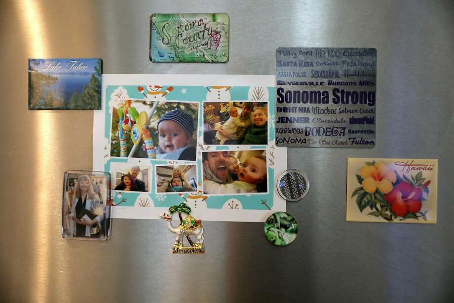 Magnets on the Granger's fridge in the Santa Rosa townhouse they rented after the Tubbs Fire destroyed their home. Photo: Guy Wathen / The Chronicle