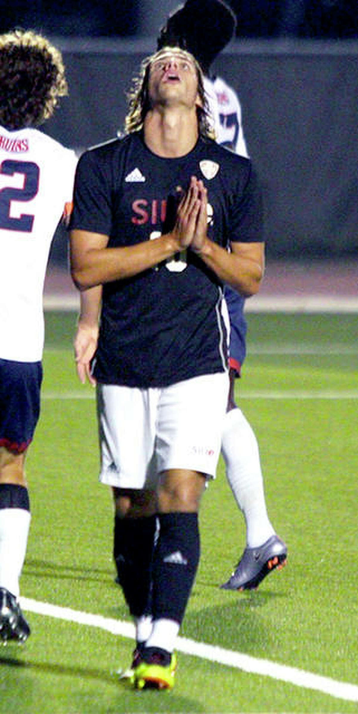 Jorge Gonzalez of SIUE looks skyward and folds his hands during the team’s 2-0 victory over Belmont Saturday night at Korte Stadium. Gonzalez leads the 6-1-2 Cougars with six goals. SIUE will travel to Indianapolis Tuesday to face IUPUI.