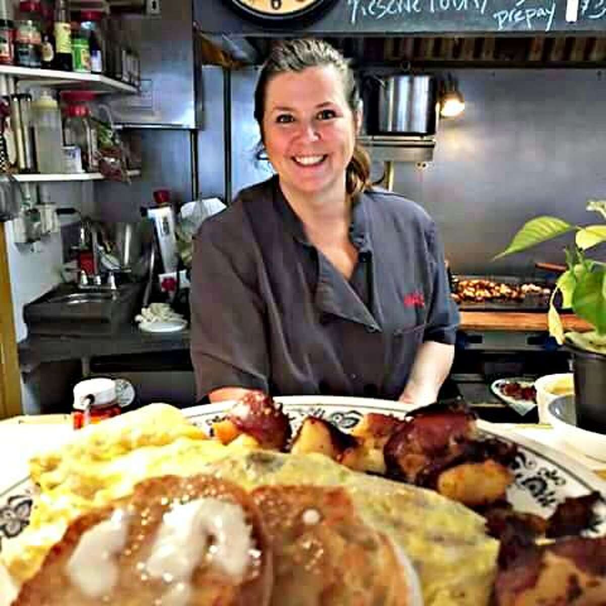 The Whistle Stop Cafe in Deep River marks its 25th year in October. Here, owner Hedy Watrous serves up a hearty breakfast.