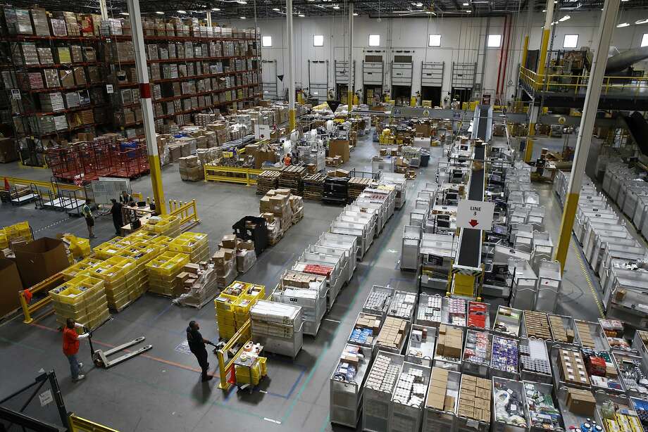 In this Aug. 3, 2017, photo file, employees ready to move products at an Amazon fulfillment center in Baltimore. Poor weather that struck a facility is delaying delivery for some packages.

>> Here are some tips and tricks when shopping Amazon that you should get to know ... Photo: Patrick Semansky, Associated Press