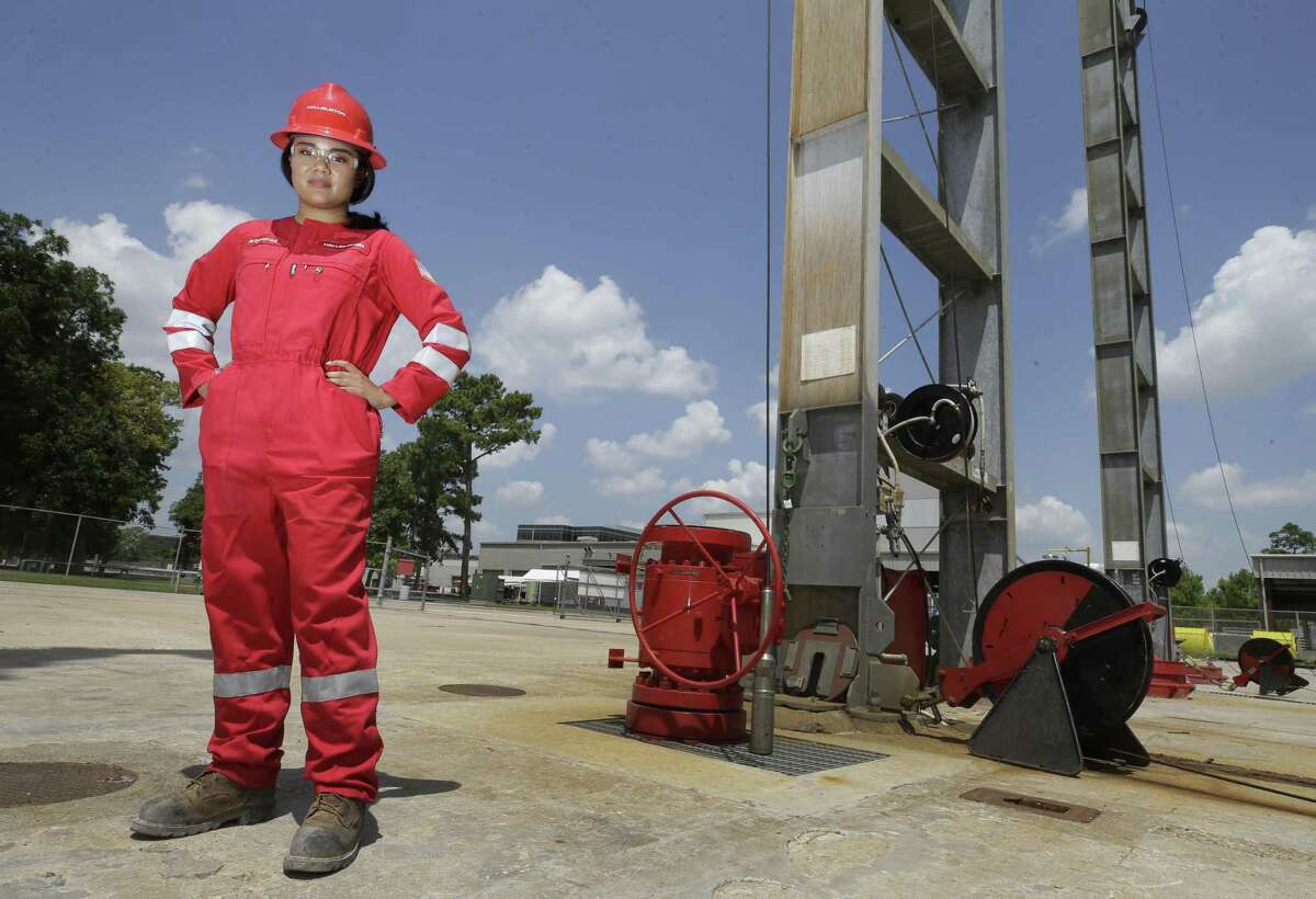 Maysarah Mikail, a Halliburton senior technical professional, poses in her gender-specific coveralls at Halliburton,3000 North Sam Houston Pkwy. East, Friday, Aug. 17, 2018, in Houston.