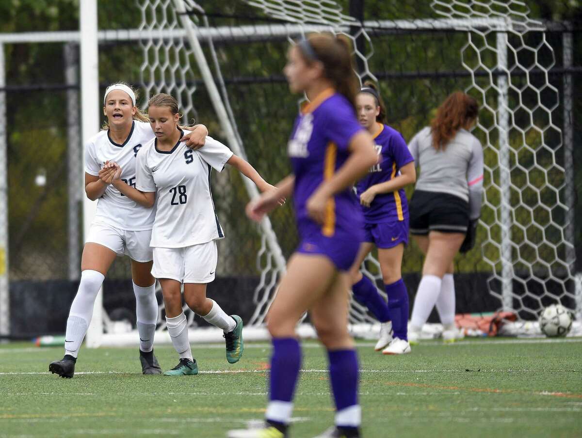 Staples Marlo Von der Ahe (25) celebrates her first half goal against Westhill with teammate Sasha Hamer (28) in a FCIAC girls soccer game on Oct. 2, 2018 in Stamford, Connecticut. Staples defeated Westhill 4-1.