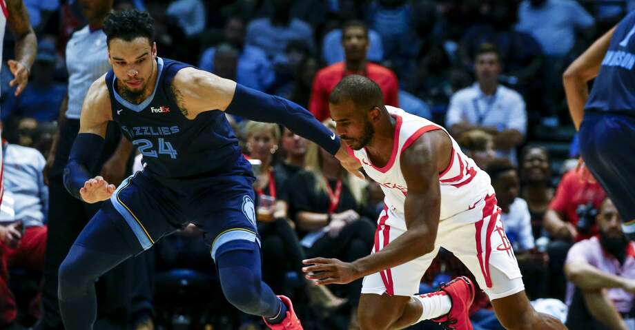 Houston Rockets guard Chris Paul (3) and Memphis Grizzlies guard Dillon Brooks (24) scramble for a loose ball during the first half of a preseason NBA basketball game, Tuesday, Oct. 2, 2018, in Birmingham, Ala. (AP Photo/Butch Dill) Photo: Butch Dill/Associated Press