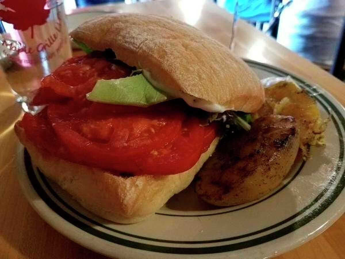 The tomato sandwich at Maple Grille, 13105 Gratiot Road in Hemlock. 'With life changing smoked potatoes and delicata squash on the side, that perfect ciabatta bread, and a beautiful pile of organic tomatoes, you have yourself an awesome sandwich. Homemade mayo with some additions gave it all a nice zip.' (Matthew Woods | for the Daily News)