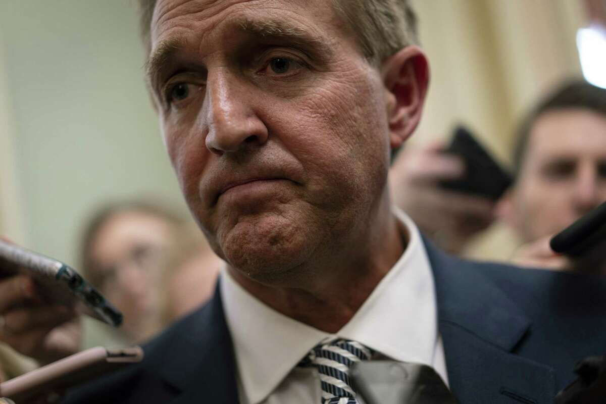 Sen. Jeff Flake, R-Ariz., speaks with the media at the U.S. Capitol in Washington on Sept. 28, 2018.