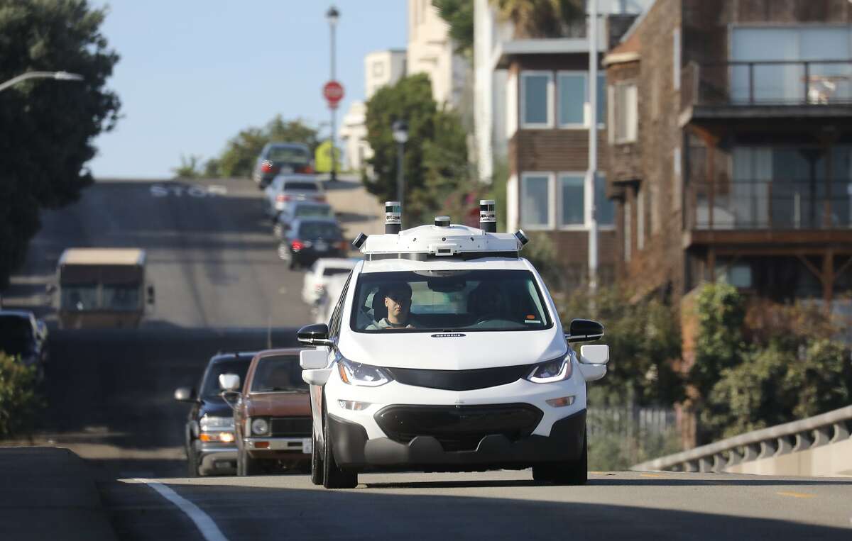 FILE-- General Motors debuts its new self driving vehicle at a press event in San Francisco, Nov. 28, 2017. Honda will take a $750 million stake in Cruise, GM's self-driving car venture, and commit $2 billion over 12 years in the race to develop fully autonomous vehicles. (Jim Wilson/The New York Times)