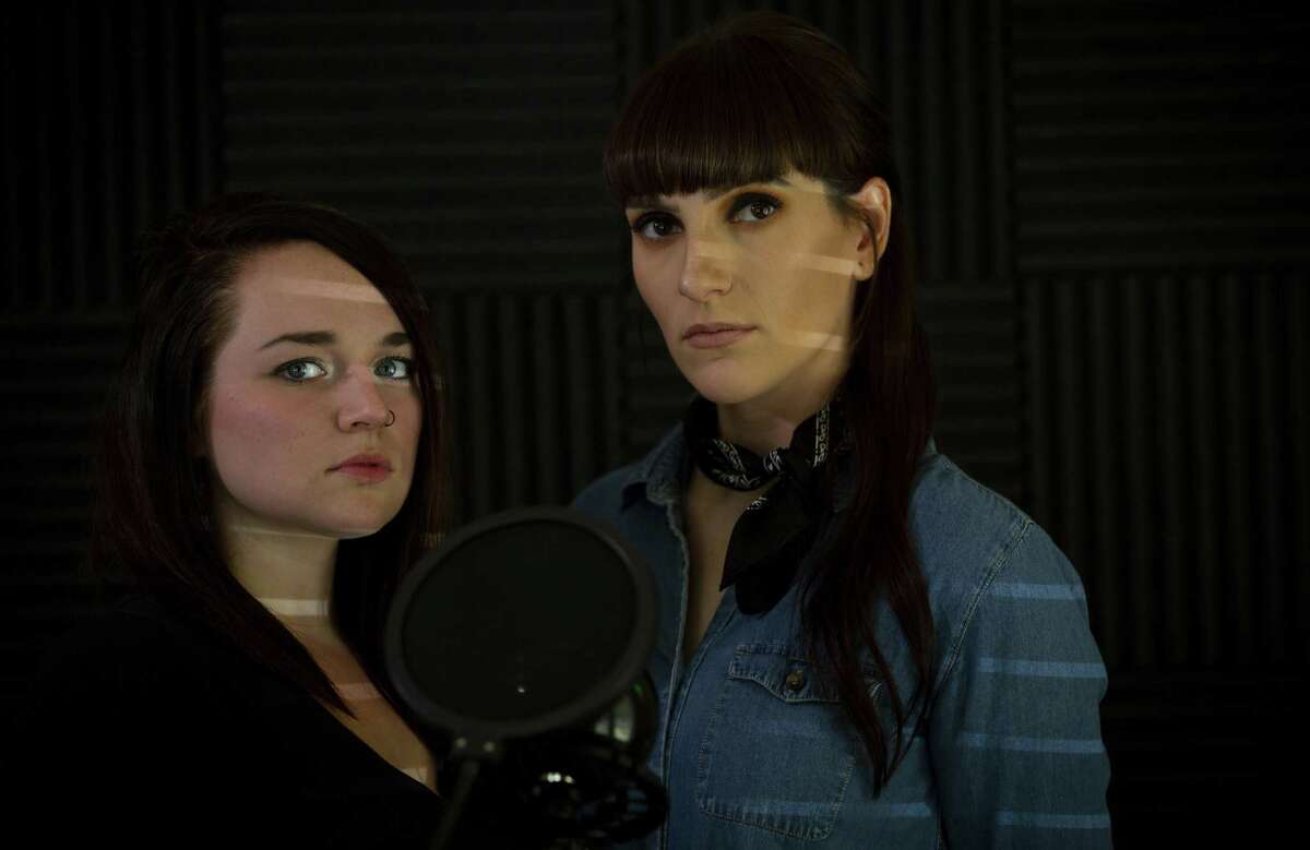 Cassie Jackson, left, and Hannah Cooper record their true-crime podcast Texas 10-31 from a room in Cooper’s Houston home. The pair have been watching their podcast listener numbers rise as they tell stories of Texas murders.
