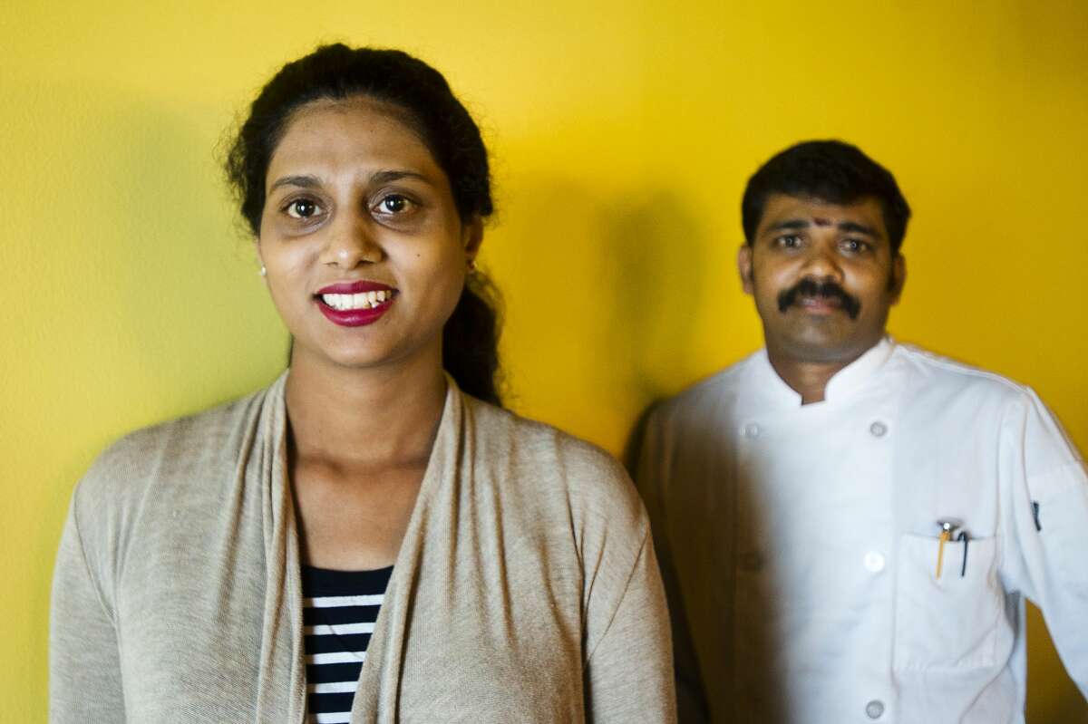 Sowmya Dasari, owner/manager of new Indian restaurant Idli Dosa, left, and chef Muthu Pandy, right, pose for a portrait inside the restaurant, which opens Thursday, Oct. 4, 2018 and features traditional Indian cuisine. (Katy Kildee/kkildee@mdn.net)
