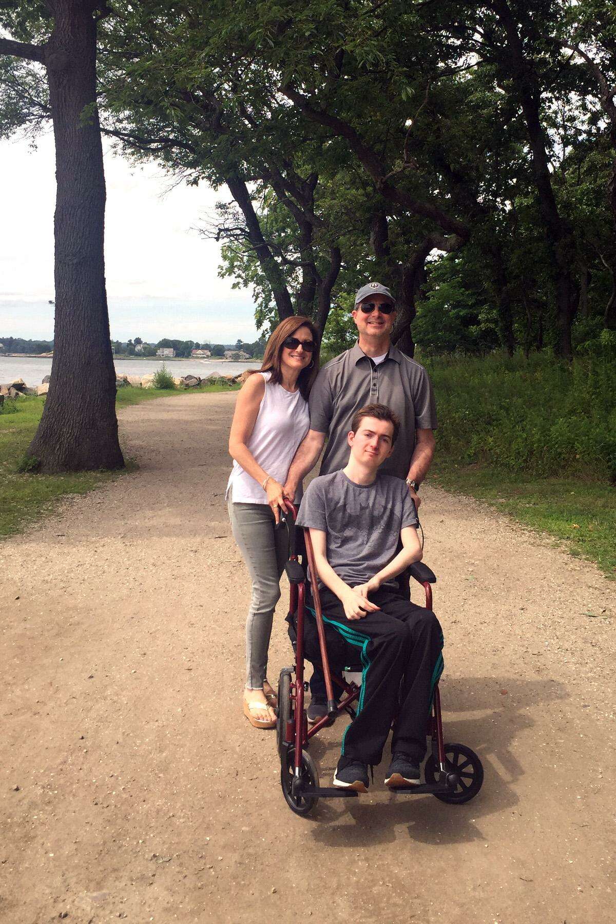 Phil and Andrea Marella pose with their son Andrew at Greenwich Point. Andrew, like his late sister Dana, has the rare disease of Nieman Pick Type C and the non profit Dana?’s Angels Research Trust will hold a special walk at Greenwich Point on Oct. 6 to continue to fund vital research.