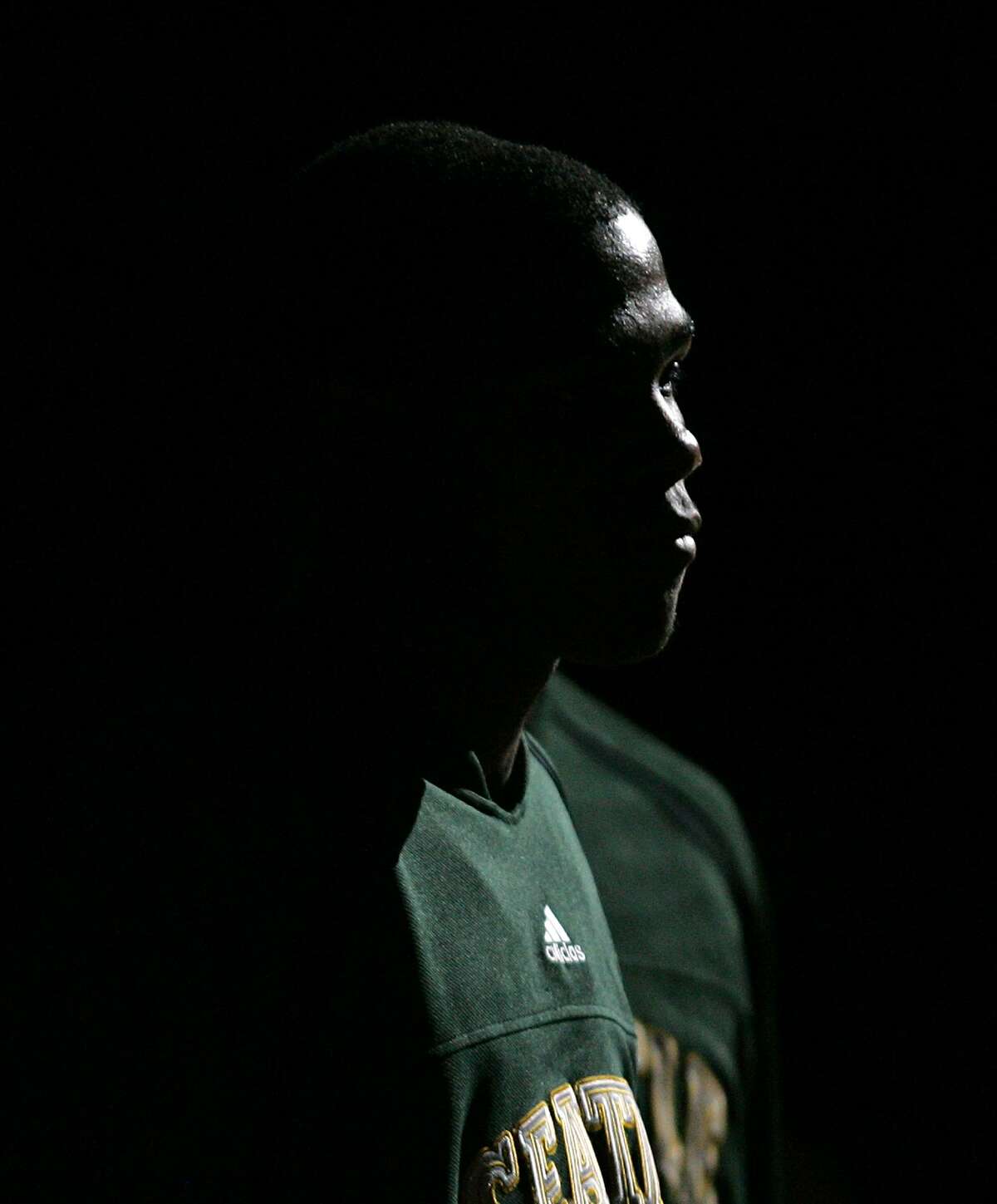 Seattle SuperSonics' Kevin Durant is lit with a spotlight during player introductions prior to an NBA exhibition basketball game against the Golden State Warriors Tuesday, Oct. 23, 2007 at KeyArena in Seattle.