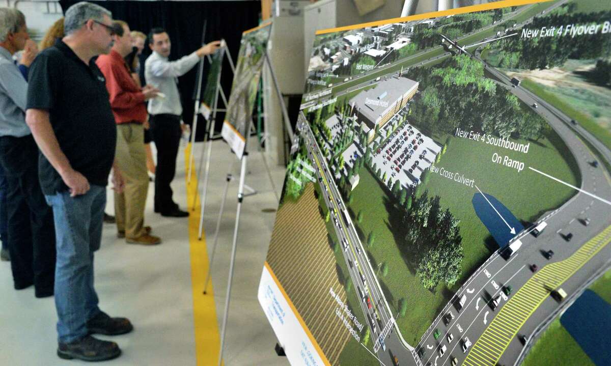 Artist concepts of a $92 million investment in the Capital Region that will connect I-87 motorists directly with Albany Airport via Exit 4, a new parking garage and other improvements on display during a news conference at the airport Tuesday August 14, 2018 in Colonie, NY. (John Carl D'Annibale/Times Union)