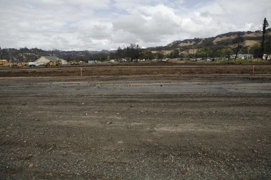 Location where the Estancia Apartment Homes were burnt to the ground seen on Old Redwood Highway on Wednesday, Oct. 3, 2018. One year after the Wine Country Fires, progress is slow moving with some residents still uprooted and much more left to rebuild. Photo: Katie Wood/SFGATE 