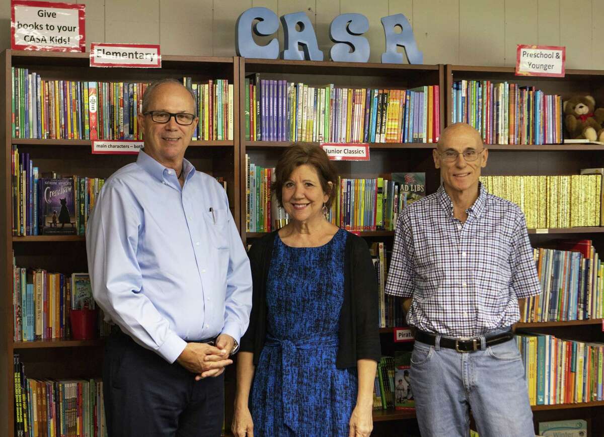 From left, Casa volunteer Mike Driscoll, CASA executive director Ann McAlpin and CASA volunteer Ron Finch work together at the Court Appointed Special Advocates for children in Montgomery County. CASA in Montgomery County is looking for more male volunteers to connect with young men whose parents are going through the court system.
