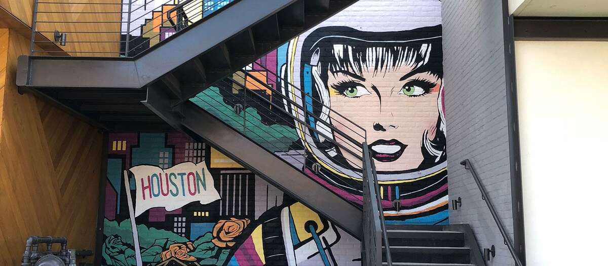 The 'Space City' mural by local artist Michael C. Rodriguez depicting a female astronaut against the Houston skyline is located on the Amherst Street garage stairwell in Rice Village. Trademark Property Co. has been adding public art to enliven the shopping and entertainment district.