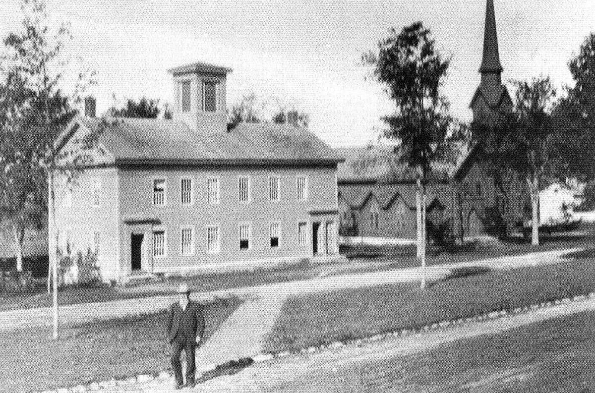 Flashback Bridgewater village center Courtesy of 'Images of America - Roxbury and Bridgewater' SPECTRUM/Prominent for many years along Main Street (Route 133) in the Bridgewater village center, the Grange Hall served as a schoolhouse until it was purchased in 1900. To the right in this photo of more than a century ago is St. Mark's Church. Above, a pedestrian ambles across the village green. The Girl Scouts planted a Christmas tree there during the Great Depression that still graces the Green and is the gathering point for Bridgewater's holiday celebrations. Those who would like to loan or contribute a photo from any of the Greater New Milford-area towns should bring it to Norm Cummings at the Greater New Milford Spectrum office at 45B Main St. If the photo is to be returned, please leave a phone number and mailing address.