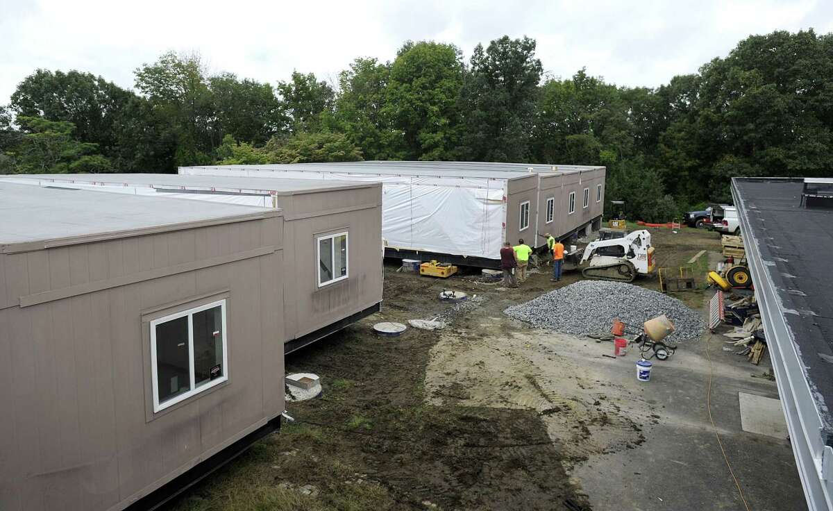 Crews are installing the new modular classroom additions for Westside Middle School Academy in Danbury, Friday, Sept. 21, 2018.