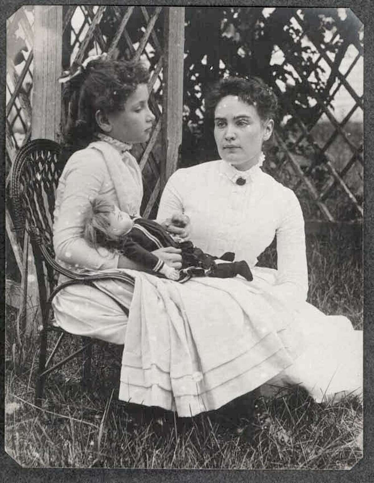 This 1888 photo released by the New England Historic Genealogical Society in Boston shows Helen Keller when she was eight years old, left, holding hands with her teacher, Anne Sullivan, during a summer vacation to Brewster, Mass., on Cape Cod. The State Board of Education will remove 40 minutes of teaching on Keller from Texas schools.
