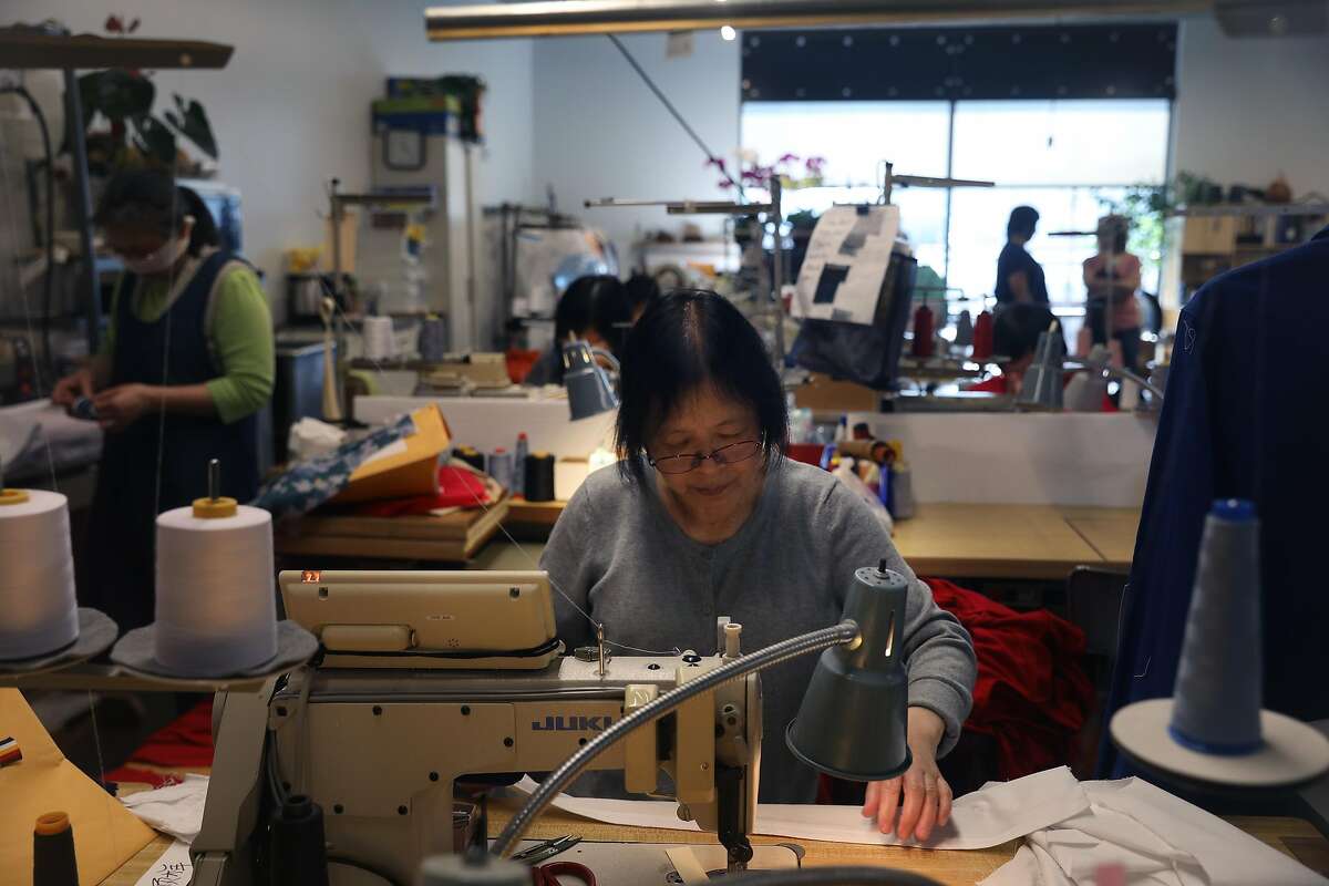 Lai Leung, seamstress, works at a sewing machine at Yorkland Productions at 150 Hooper on Friday, October 5, 2018 in San Francisco, Calif.