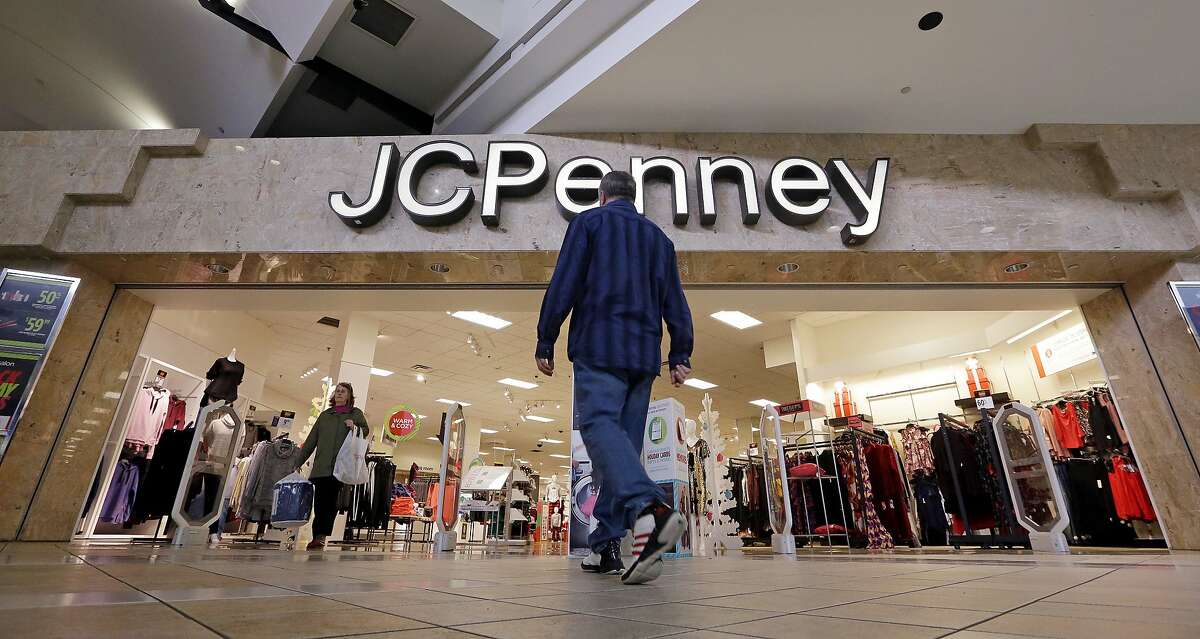 FILE- In this Nov. 24, 2017, file photo, a shopper heads into a J.C. Penney store in Seattle J.C. Penney Co. reports financial results on Friday, March 2, 2018. (AP Photo/Elaine Thompson, File)