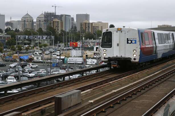a westbound bart train arrives at the west oakland station in