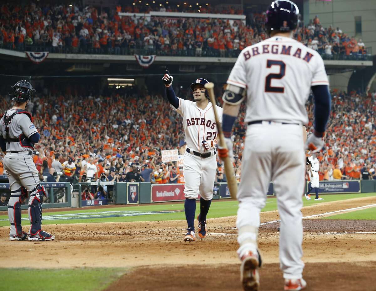 Houston Astros second baseman Jose Altuve (27) celebrates a home run in the fifth inning of Game 1 of the American League Division Series at Minute Maid Park on Friday, Oct. 5, 2018, in Houston.