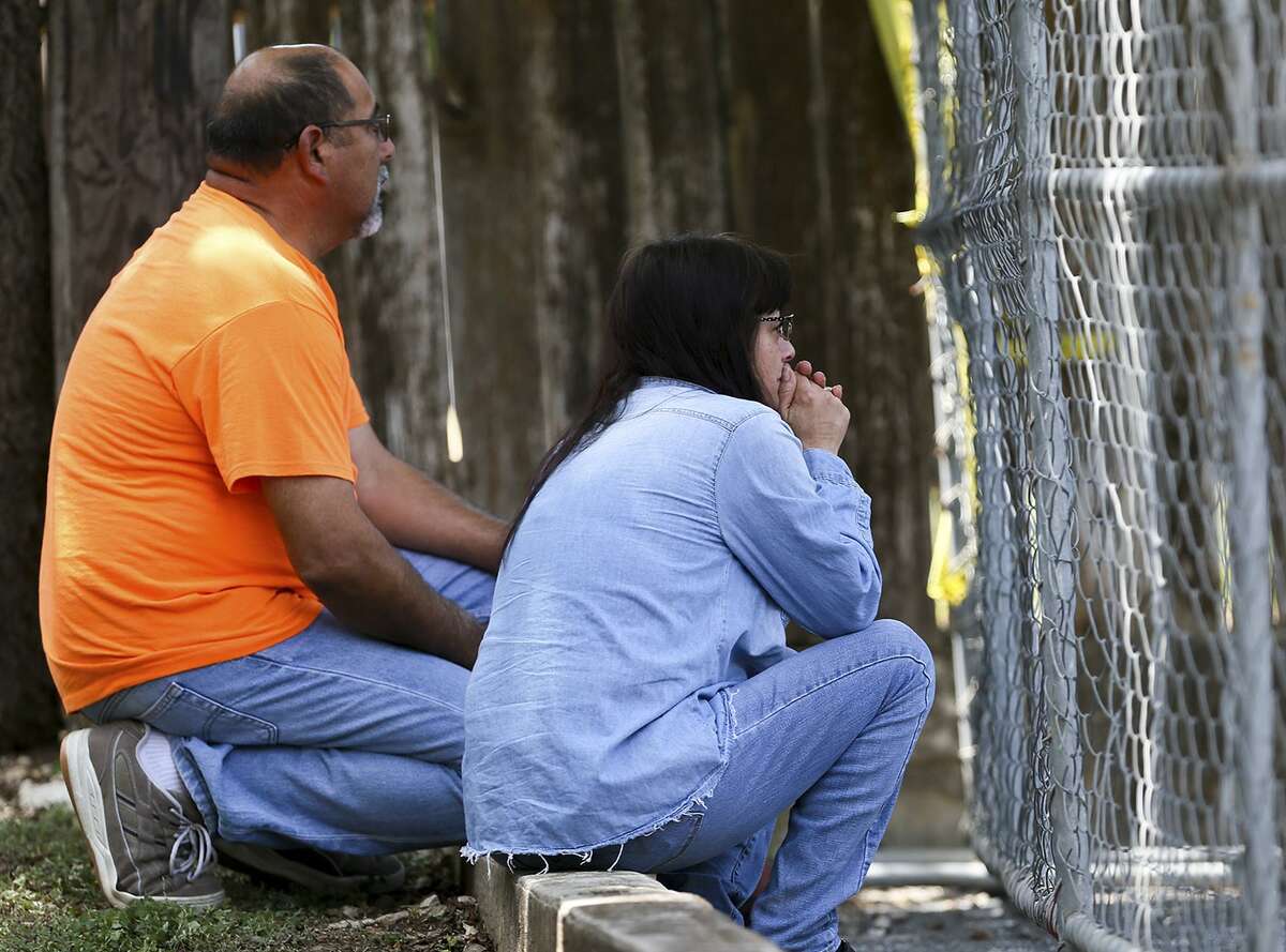 Family members of Belinda Moats wait for news about her whereabouts in July outside Iconic Village Apartments in San Marcos after the property was gutted by a catastrophic fire. Moats, 21, of Big Wells, was later found dead in the rubble of Building 500, where she lived. Moats was one of five victims found dead after the blaze.