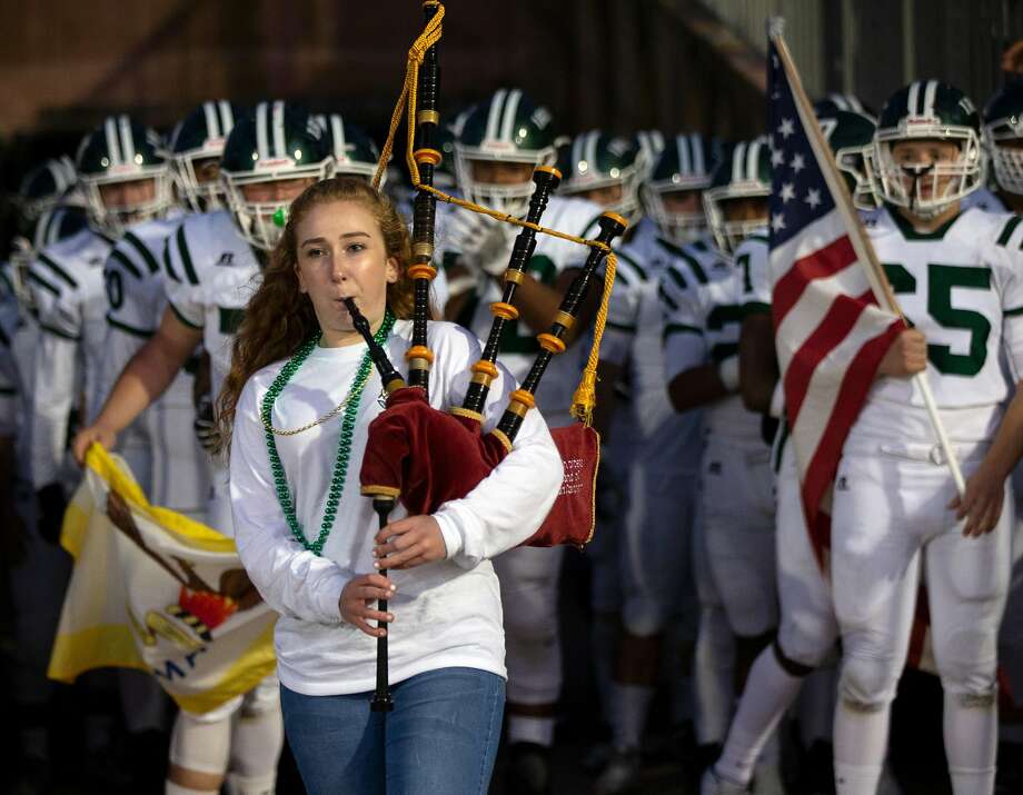 Sacred Heart Cathedral freshman Maura Baglin play her team onto the field with a bagpipe solo before a high school football game against St. Ignatius on Friday, Oct. 5, 2018 in San Francisco, Calif. Photo: D. Ross Cameron / Special To The Chronicle