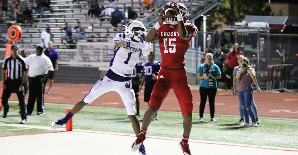 Crosby sophomore Jaden Fields intercepts a Bronco pass while Dayton's wide receiver Jermond Lovely watches helpless in the end zone. The Cougars took the ball down the field before they turned it over in the see-saw battle of Highway 90.