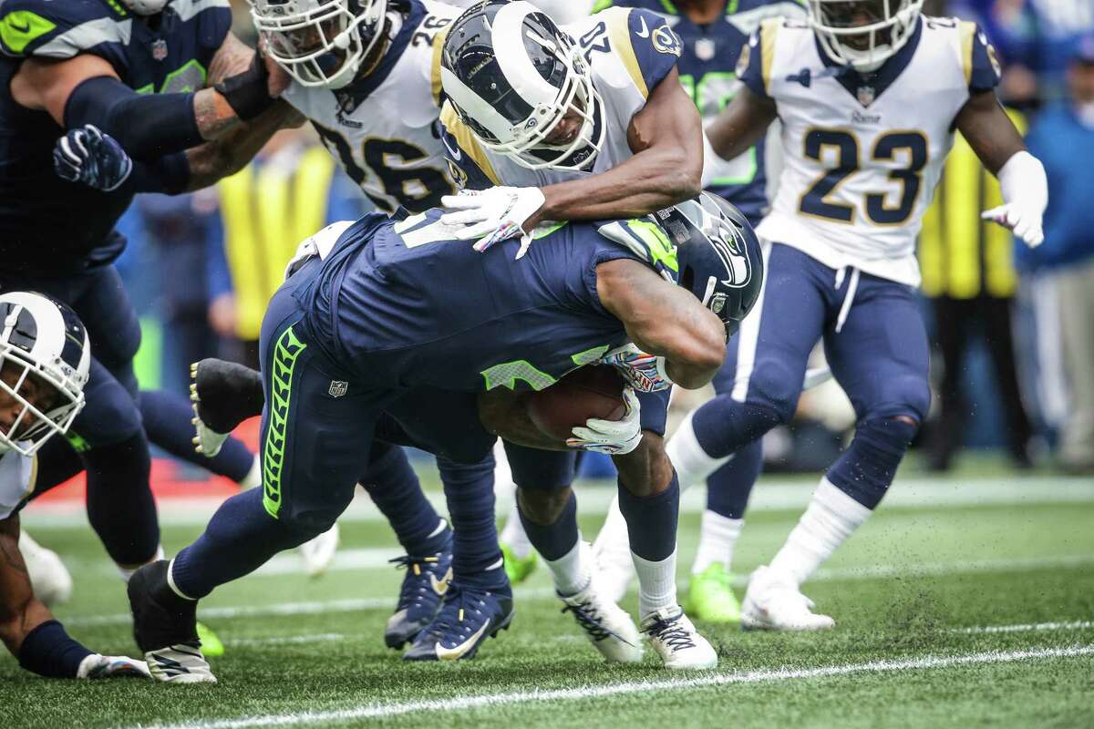 Seahawks running back Mike Davis scores a touchdown during the first half of the Seahawks game against the Los Angeles Rams, Sunday, Oct. 7, 2018 at CenturyLink Field.