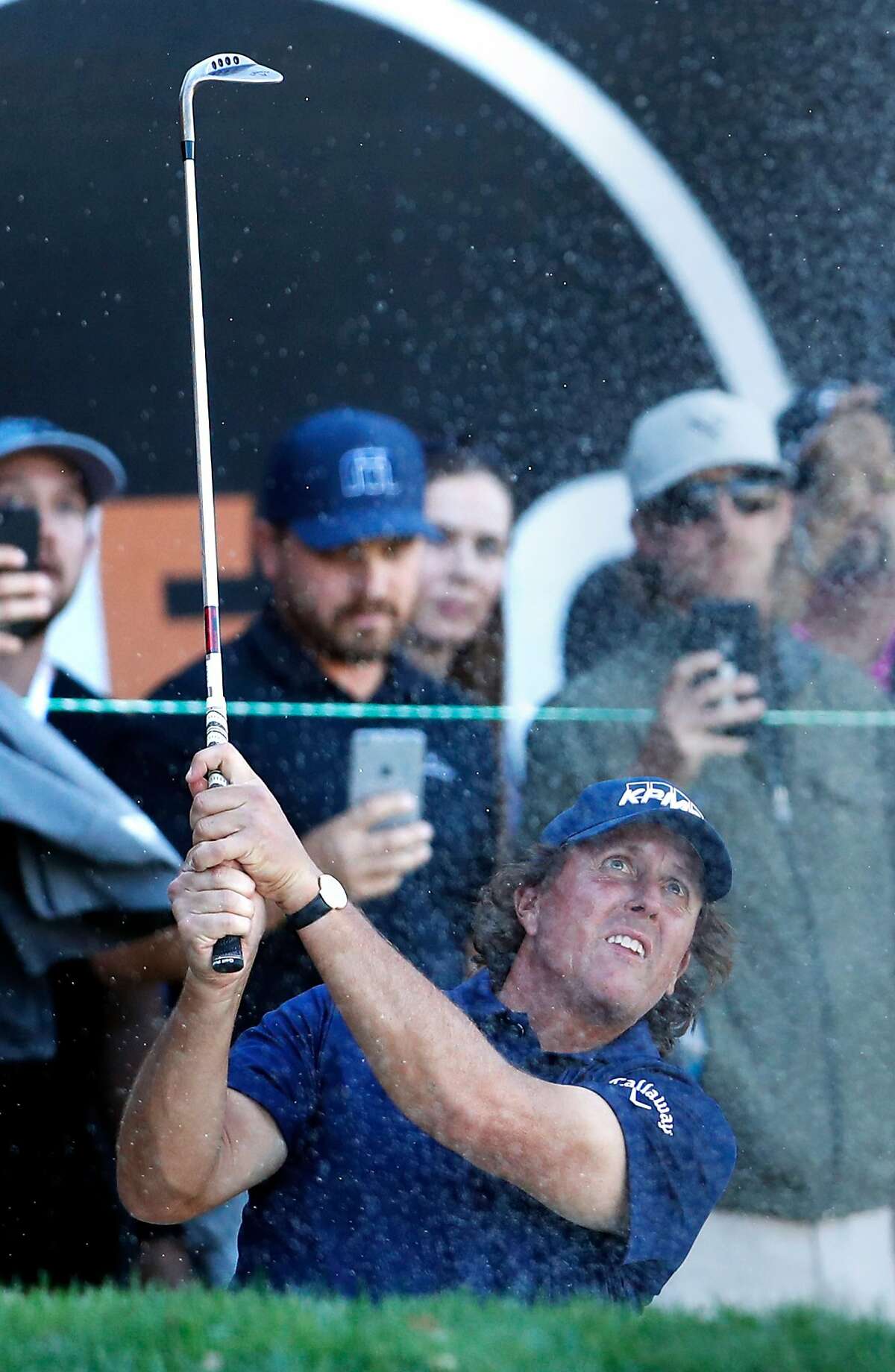 Phil Mickelson hits out of bunker on 18th hole during final round of Safeway Open at Silverado Resort in Napa, Calif. on Sunday, October 7, 2018.