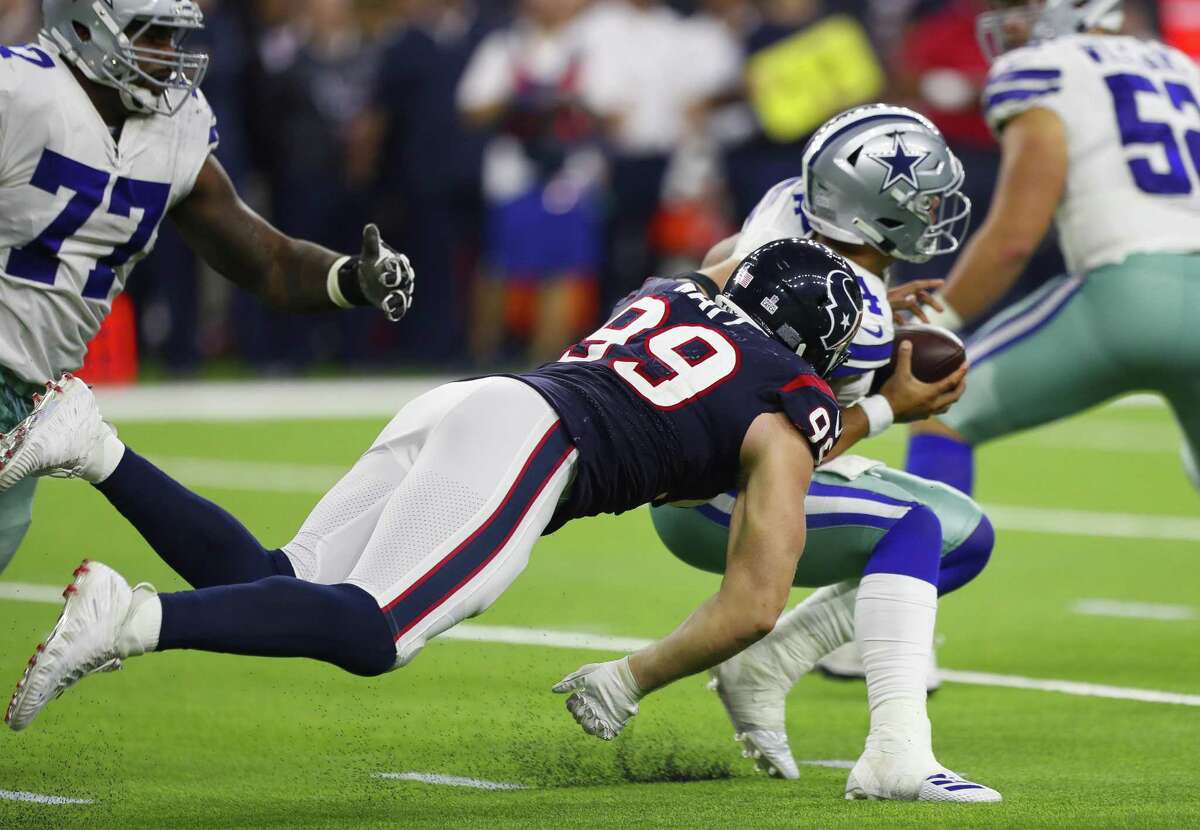 Houston Texans' J.J. Watt prepares to throw out the first pitch