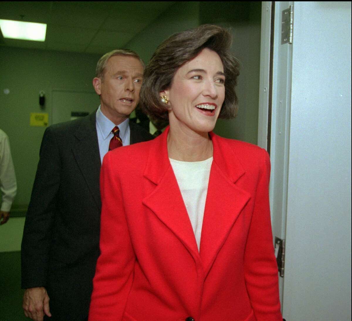 Democratic gubernatorial candidate Kathleen Brown, right, and Republican Gov. Pete Wilson leave a Sacramento, Calif., television studio Friday, Oct. 14, 1994, after finishing their only planned debate. (AP Photo/George Nikitin)
