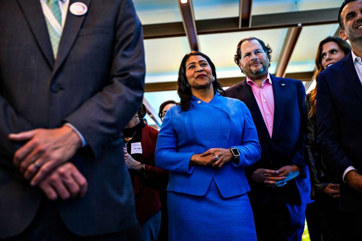 Mayor London Breed (center) and Salesforce CEO Marc Benioff (center,right) listen to a speech at the Healthy Oceans Climate Reception at Salesforce East in San Francisco on Sept. 13, 2018.