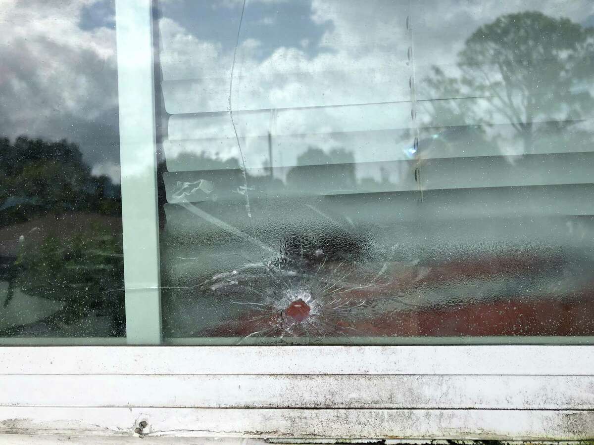 One of the bullet holes where a gunman fired into an apartment on Hammerly Boulevard, striking a 12-year-old girl in the stomach Friday night.