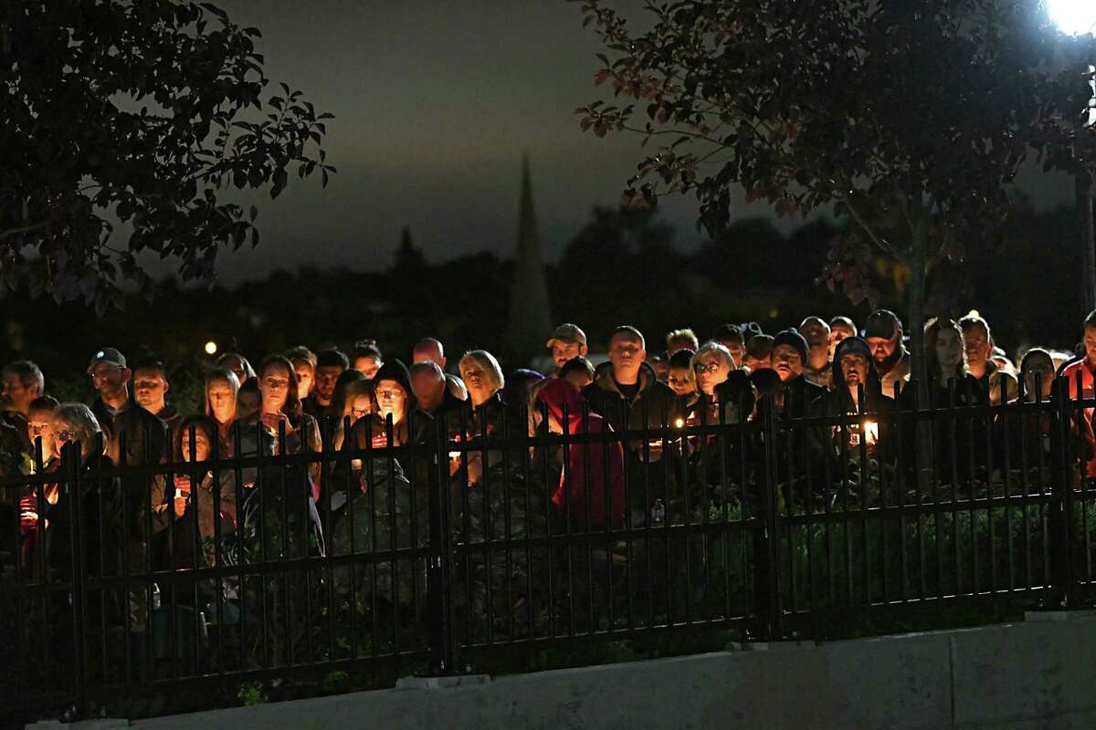 People on a bridge hold candles during a vigil for the victims of the limousine crash in Schoharie at The Mohawk Valley Gateway Overlook on Monday, Oct. 8, 2018 in Amsterdam, N.Y. (Lori Van Buren/Times Union)